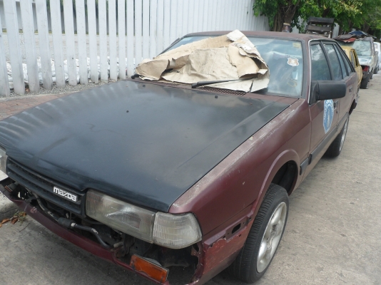 ต้องการขายรถยนต์มาสด้าแดงเพลิงสาพเก่ามากพร้อมใช้