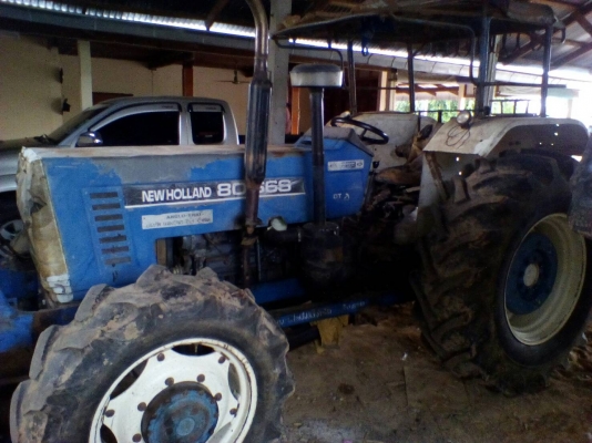 ขายรถไถ ยี่ห้อNEWHOLLAN 2เพลา อุปกรณ์ใบดันผานหลัง