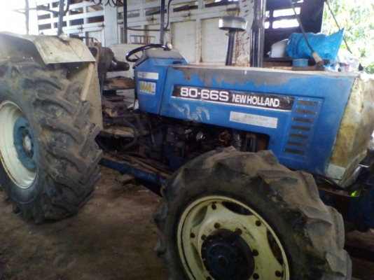 ขายรถไถ ยี่ห้อNEWHOLLAN 2เพลา อุปกรณ์ใบดันผานหลัง