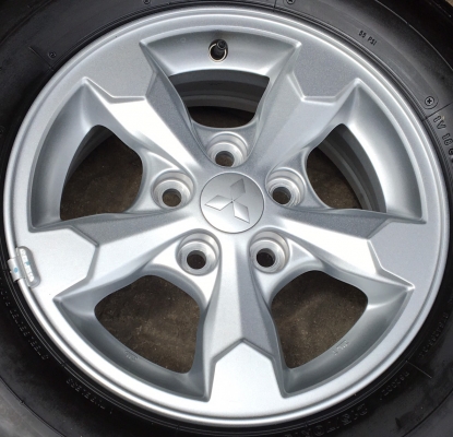 ล้อแม็กป้ายแดง Mitsu Triton ขอบ 15 พร้อมยางป้ายแดง 215-70-15 Bridgestone ปลายปี 17