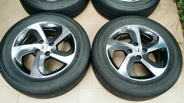 ล้อแม็กฮอนด้า ขอบ15 4รู100 พร้อมยางบริดสโตน อีโคเปีย ปี15(3115) 4ล้อ