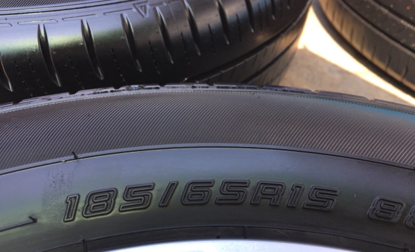 ล้อแม็กป้ายแดง Nissan 4รู100 ขอบ 15 พร้อมยางป้ายแดง Dunlop 185-65-15