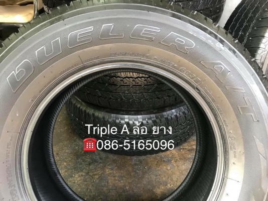 ยางป้ายแดง Bridgestone 265-65-17 ปี 18 ตุ่มเด้งๆ เส้นสีชัด ยางป้ายแดง Bridgestone 265-65-17 ปี 18 ตุ่มเด้งๆ เส้นสีชัด