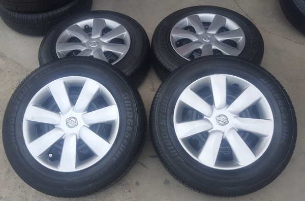 ขายล้อกะทะ NISSAN ขอบ14 พร้อมยางฝาครอบ 4 ล้อ