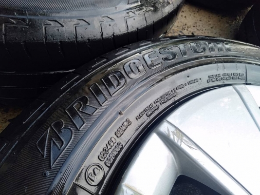 ล้อกระทะเก๋งมิตซูบิชิ ขอบ14 4รู100 พร้อมยางบริดสโตน ปี13 ชุด4ล้อ