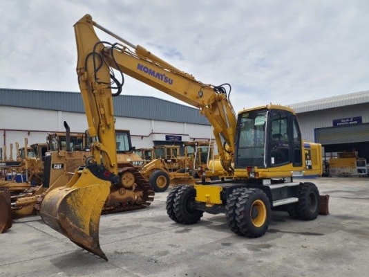 รถขุดล้อยาง PW130ES-6K มีลายหัวเจาะ มือสองยุโรป