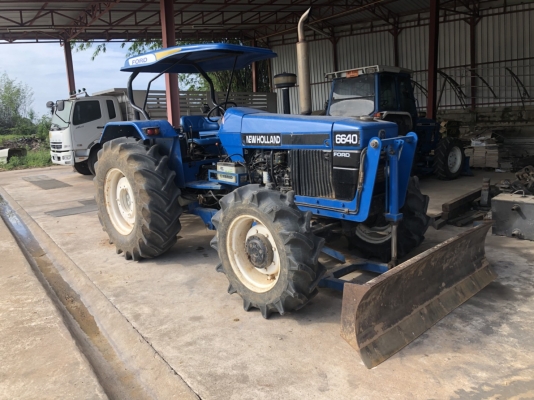 ขายรถไถ  FORD NEWHOLLAND 6640 ปี1996 เกีย์รกลาง คานนิว  มีอุปกรณ์ดันหน้า ผานเจ็ด  ยางดี ภาษีไม่ขาดเล่มทะเบียนพร้อมโอน