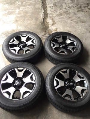 ล้อรีโว้ร๊อคโค่ ขอบ18 สีทูโทนดำหน้าเงา+บริสโตน265/60/18ปี19 ถอดป้ายแดงวิ่ง300โล ชุด28500บ.โทร0879050181