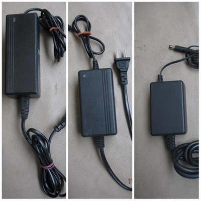 Ac/Dc Adapter 12 V สภาพใช้งานได้ปกติ จำนวน 3 ตัว (มัดรวม) Ac/Dc Adapter 12 V สภาพใช้งานได้ปกติ จำนวน 3 ตัว (มัดรวม)