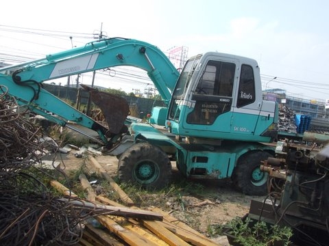 ขายรถแมคโคล้อยาง KOBELCO  100W  พร้อมลายหัวเจาะ