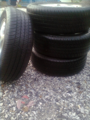 ขายแม็กHONDAพร้อมยาง 4 รู ขอบ14 185/65R14 ยางดีสโตร์ ปี11 สวยๆ 1 ชุด