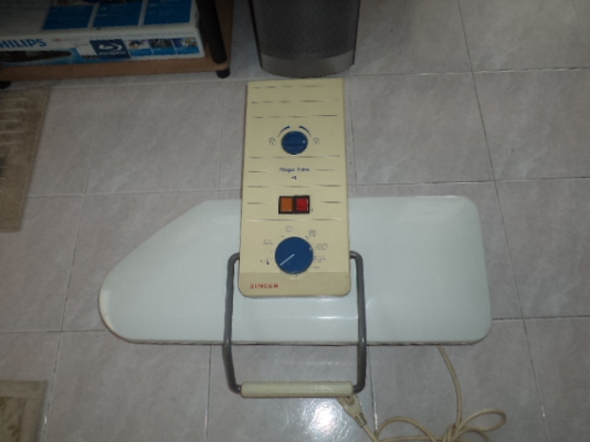 เตารีดแบบอัดกดทับ