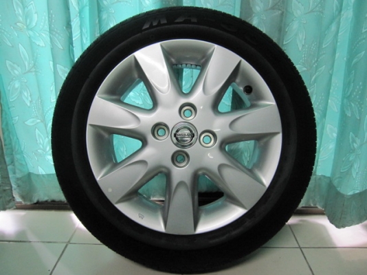 ขายล้อแม็ก Nissan march พร้อมยางป้ายแดงปี 13 ขอบ 15 ตุ่มหน้ายางมีครบทุกเส้น