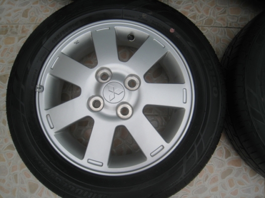 ขายแม็ก Mitsubishi mirage ถอดรถป้ายแดง 14"x4.5" et46 4รู100 +ยางปี0313  ตุ่มและสีหน้ายางมี(081-3747940)