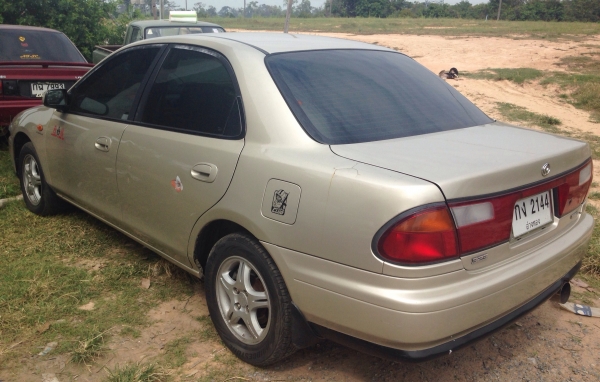 MAZDA 323 SEDAN 1.6 AT ปี 97 เครื่องแห้งแรงดีเดิมๆพร้อมใช้งาน ติดตั้งแก๊ส LPG ครบแล้ว ภายในเก๋งคอนโซลสวยครบ แอร์เย็น พ.เพาเวอร์ ก.ไฟฟ้า ภายนอกสีสันบางเดิมไม่มีชนหนัก ช่วงล่างล้อแม็กลายสวย ยางสภาพดี 4 เส้นประมาณ 70\% พร้อมใช้งาน เอกสารทะเบียนครบพร้อมโอน ราค