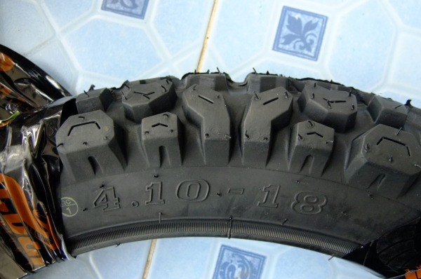 ยางวิบาก4.10 ของใหม่ พร้อมขอบเหล็ก 1.85 ขอบ 18 ยางวิบาก4.10 ของใหม่ พร้อมขอบเหล็ก 1.85 ขอบ 18