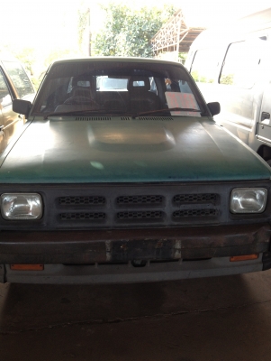 mazda รถ 4 ประตูสีเขียว