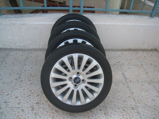 ขายล้อแม็กเดิม ford fiesta 15"x6"  4/100 et45 +ยางปี09(081-3747940)