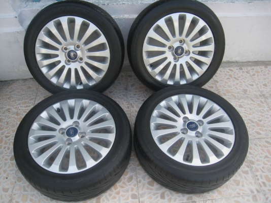 ขายล้อแม็กเดิม ford fiesta 15"x6"  4/100 et45 +ยางปี09(081-3747940)