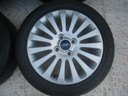 ขายล้อแม็กเดิม ford fiesta 15"x6"  4/100 et45 +ยางปี09(081-3747940)