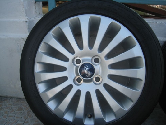 ขายล้อแม็กเดิม ford fiesta 15"x6"  4/100 et45 +ยางปี09(081-3747940)