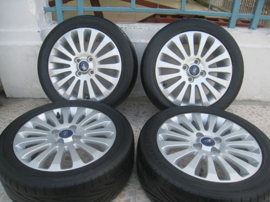 ขายล้อแม็กเดิม ford fiesta 15"x6"  4/100 et45 +ยางปี09(081-3747940)