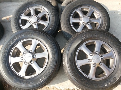 ขายล้อแม็กISUZU 16 นิ้ว 6 ก้าน ( สีกัลเงา ) พร้อมยาง BRIDGESTONE DUELER HT 1 ชุด