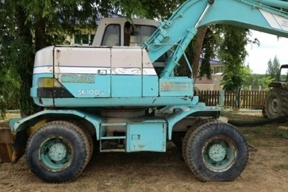 แบคโฮล้อยางKOBELCO SK100W 2เพลาเก่านอกพร้อมหัวเจาะ