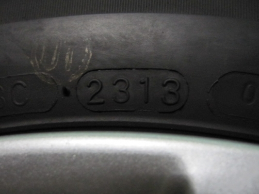 ขายล้อกะทะพร้อมยางป้ายแดง Nissan March ขอบ 14 ตุ่มหน้ายางมี