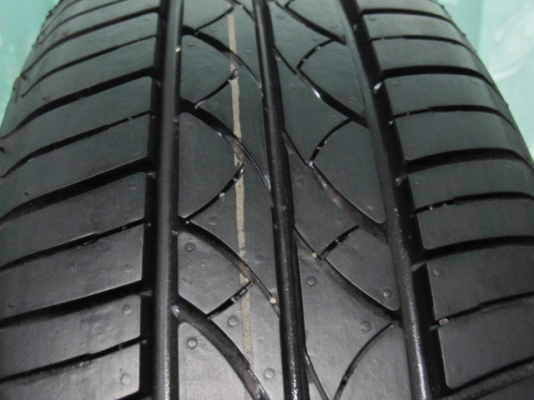 ขายล้อกะทะพร้อมยางป้ายแดง Nissan March ขอบ 14 ตุ่มหน้ายางมี