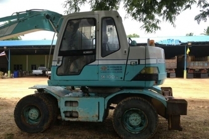 แบคโฮล้อยางKOBELCO SK100W 2เพลาเก่านอกพร้อมหัวเจาะ