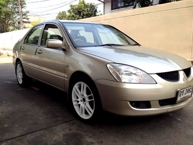 NEW LANCER 05 เกียร์ MT แท้ เบาะหนัง  แบตเตอรี่ใหม่ เซนเซอร์ถอยหลัง วิทยุซีดี สภาพสวย เล่มพร้อมโอนขนส่ง หรือ จัดไฟแนนท์ได้ครับ