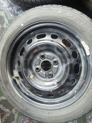 ขายล้อกะทะ15 4รู100 MAZDA พร้อมยาง 1 ชุด