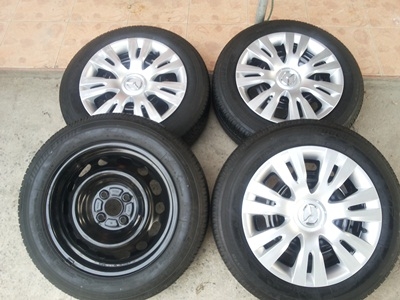 ขายล้อกะทะ15 4รู100 MAZDA พร้อมยาง 1 ชุด