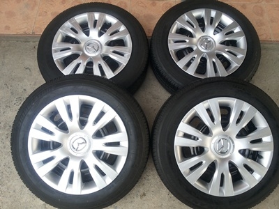ขายล้อกะทะ15 4รู100 MAZDA พร้อมยาง 1 ชุด