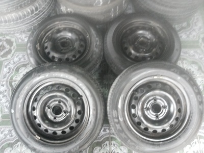 ขายล้อกะทะขอบ14 4/100 พร้อมยาง 175/60/14 ปี 10 1ชุด