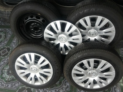 ขายล้อกะทะ15 4รู100 MAZDA พร้อมยางและฝาครอบ 1 ชุด