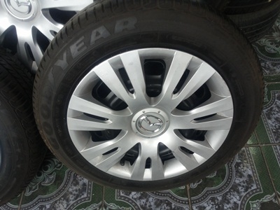 ขายล้อกะทะ15 4รู100 MAZDA พร้อมยางและฝาครอบ 1 ชุด ขายล้อกะทะ15 4รู100 MAZDA พร้อมยางและฝาครอบ 1 ชุด