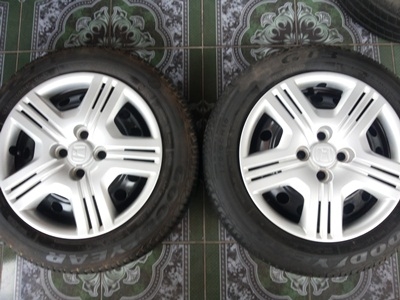 ขายล้อกะทะ HONDA ขอบ15 4รู100 พร้อมยางและฝาครอบ 4 ล้อ