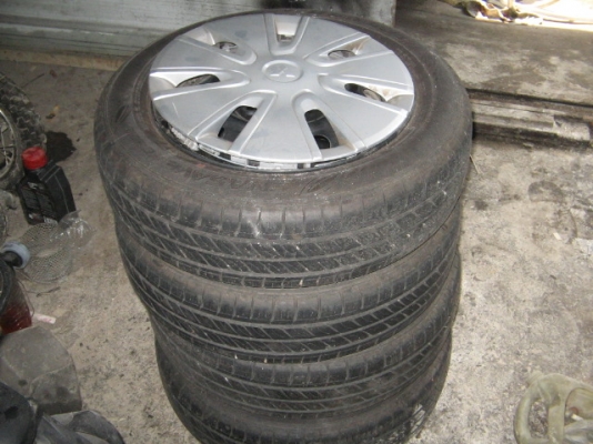 ขาย ยางพร้อมกระทะและฝาครอบครบชุดขอบ 14 4เส้น สภาพใหม่ ราคา 5,000