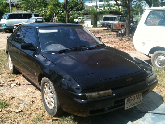 มาสด้า 323 สีดำ เกียร์ออโต้ เครื่องเดิมหัวฉีด LPG มัลติ ภายในสวย ทะเบียน เม.ย.54 พร้อมโอน ขับได้ปกติ ขาย 30,000 บาท