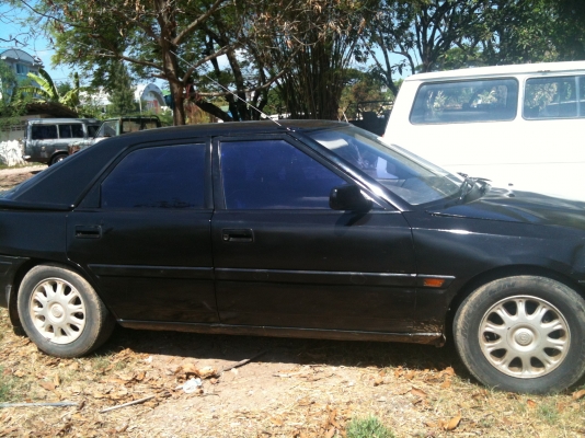 มาสด้า 323 สีดำ เกียร์ออโต้ เครื่องเดิมหัวฉีด LPG มัลติ ภายในสวย ทะเบียน เม.ย.54 พร้อมโอน ขับได้ปกติ ขาย 30,000 บาท