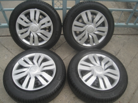 ขายกะทะล้อป้ายแดง Honda jazz,city ขอบ15 4รู100พร้อมยางปี14 สนใจติดต่อเล็กคลองสามครับ 081-3747940