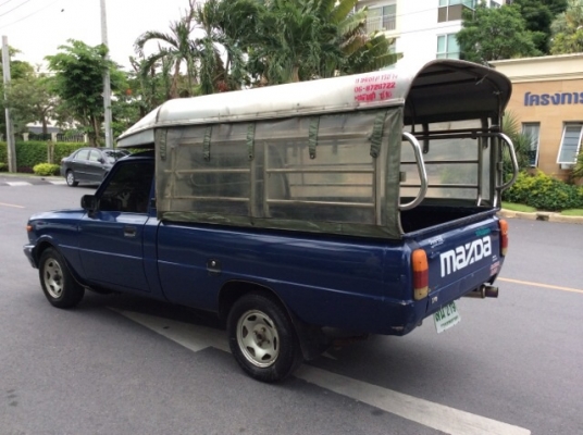 ขายรถกระบะมาสด้า แฟมิเลีย ปี 96 เครื่องเดิม 1.4 เกียร์ธรรมดา 5 เกียร์ ติดแก๊ส LPG  ถังวางใต้ท้องรถเรียบร้อย ภายในสวยเดิม แอร์พร้อม วิทยุCD จอทีวีสไลด์ ตัวถังบางเดิม สีมีริ้วรอยบ้าง คัสซีดี เครื่องวิ่งดี เกียร์แน่น บางใหม่ 4 เส้น หลังคาพร้อม รถขับดีมาก ประ