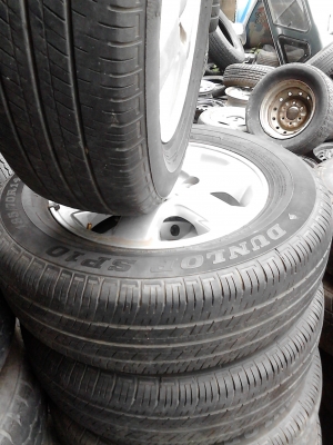 แม๊ก พร้อมยาง ขอบ 14  ขนาด 4 รู 100 185/70R14  ยาง DUNLOP SP10  TEL.081-427-3941