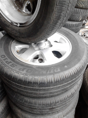 แม๊ก พร้อมยาง ขอบ 14  ขนาด 4 รู 100 185/70R14  ยาง DUNLOP SP10  TEL.081-427-3941