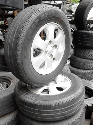 แม๊ก พร้อมยาง ขอบ 14  ขนาด 4 รู 100 185/70R14  ยาง DUNLOP SP10  TEL.081-427-3941