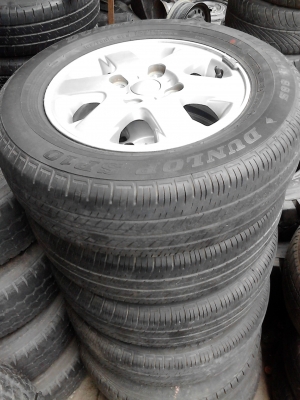 แม๊ก พร้อมยาง ขอบ 14  ขนาด 4 รู 100 185/70R14  ยาง DUNLOP SP10  TEL.081-427-3941