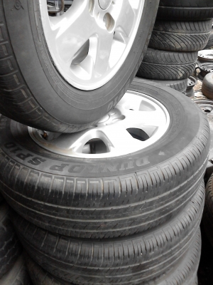 แม๊ก พร้อมยาง ขอบ 14  ขนาด 4 รู 100 185/70R14  ยาง DUNLOP SP10  TEL.081-427-3941