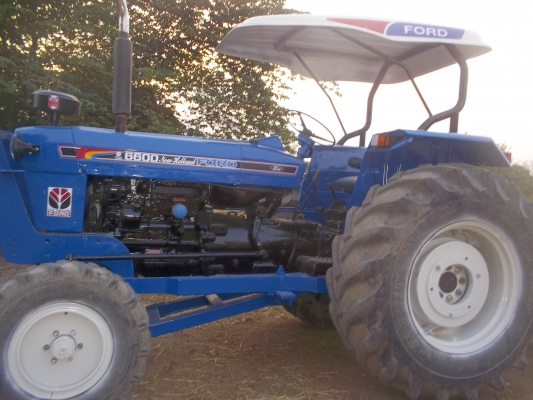 ขายรถไถฟอร์ดเครื่อง6600/ท้าย77พร้อมใบมีดและผาน6/เล่มทะเบียนพร้อมโอนสภาพพร้อมใช้